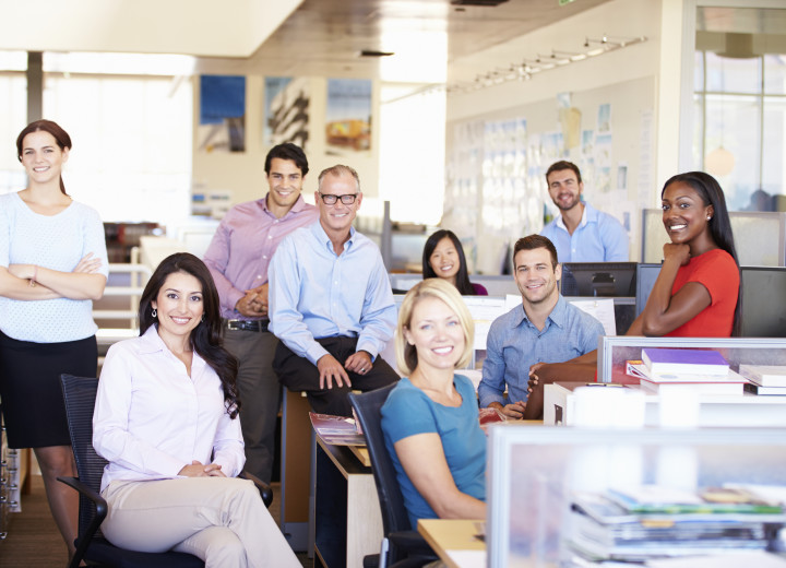 Portrait Of Businesspeople In Modern Open Plan Office